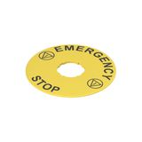 Label with shaped hole, ? 90 mm, yellow disc, writing "EMERGENCY STOP"