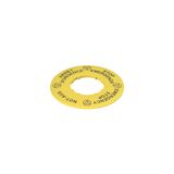 Label with shaped hole, ? 60 mm, yellow disc, writing "STOP EMERGENZA - EMERGENCY STOP - NOT-AUS - ARRET D'URGENCE"